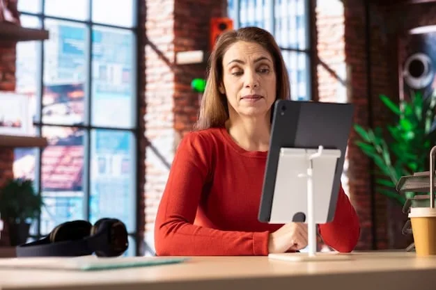 A person sitting at a desk, surrounded by monitors displaying various online shopping websites and price comparison tools. The person is pointing at one of the screens with a focused expression.
