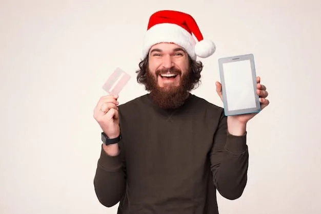 A person smiling and holding up a credit card with a holiday-themed design, symbolizing smart financial planning and preparation for holiday shopping. The image conveys a sense of readiness and confidence.