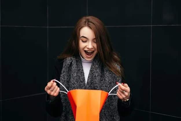 A woman smiling and holding up a deeply discounted item she found in a hidden clearance section, showcasing the excitement and satisfaction of successful secret shopping.