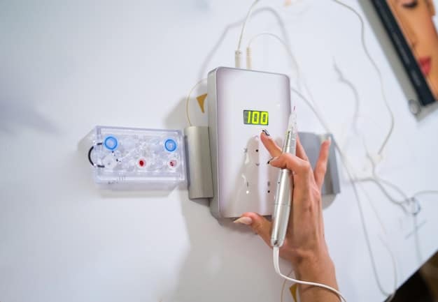 A person's hands installing a smart thermostat on a wall, with various tools and wiring visible in the background.