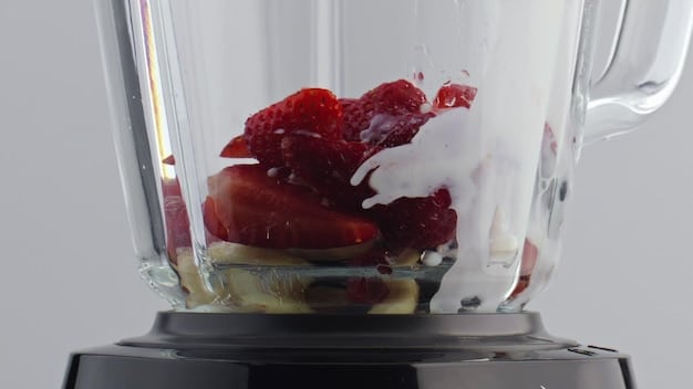 A close-up shot of a blender's blade mechanism, highlighting its sharpness and intricate design. The blades are stainless steel and appear capable of pulverizing ice and frozen fruits.
