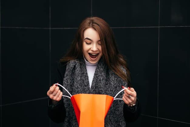 A woman smiling and holding up a deeply discounted item she found in a hidden clearance section, showcasing the excitement and satisfaction of successful secret shopping.