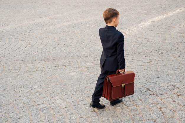 A person confidently walking away from a negotiation table, holding a briefcase and looking determined.