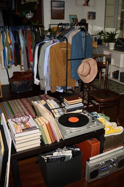 A well-organized thrift store with racks of clothing and a variety of accessories. The lighting highlights the options available for secondhand shopping.