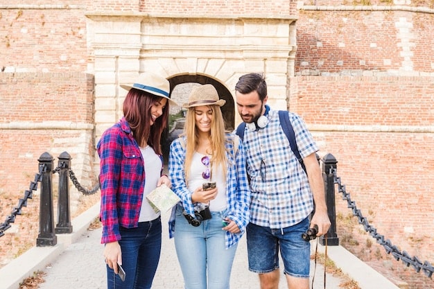 A group of travelers participating in a free walking tour of a city, showcasing the guide and the historical landmarks they are visiting.