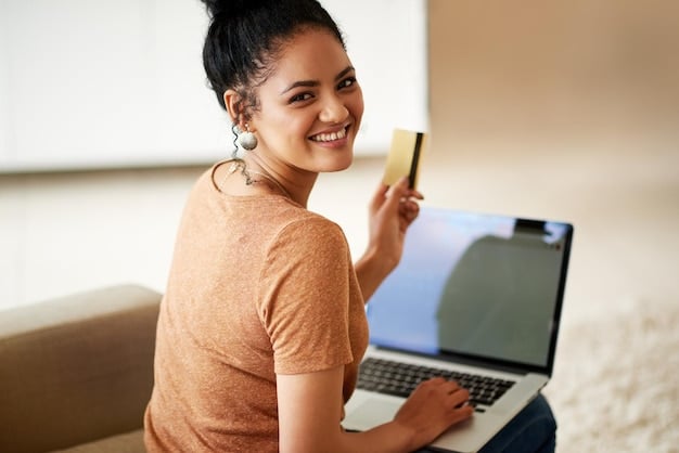 A person smiling while shopping online on a laptop, with a credit card ready for payment and holiday decorations in the background, focusing on the convenience and rewards of using a credit card for online shopping.